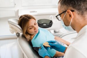 Dentist and patient discussing full mouth dental implants