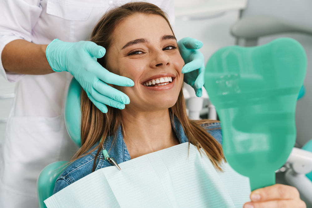 Dentist consulting a patient about dental implant recovery timeline