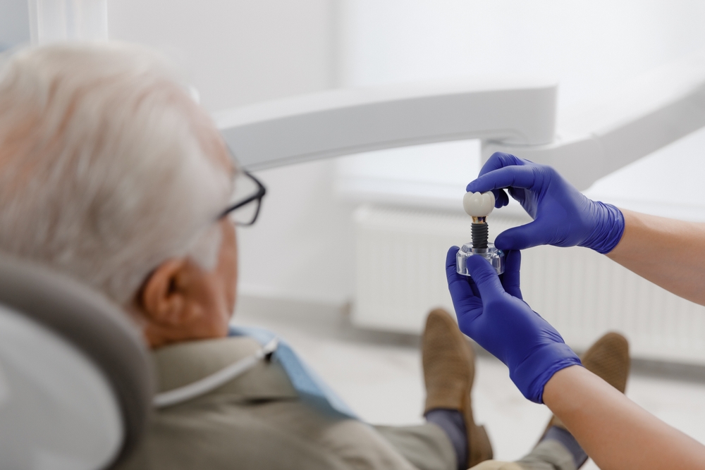 Dentist consulting with a patient about full mouth dental implants in Potomac, MD